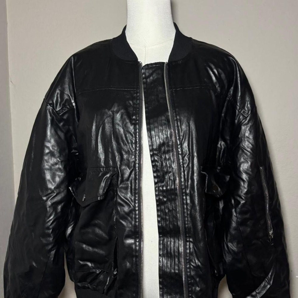 Black leather bomber jacket with zipper pockets
